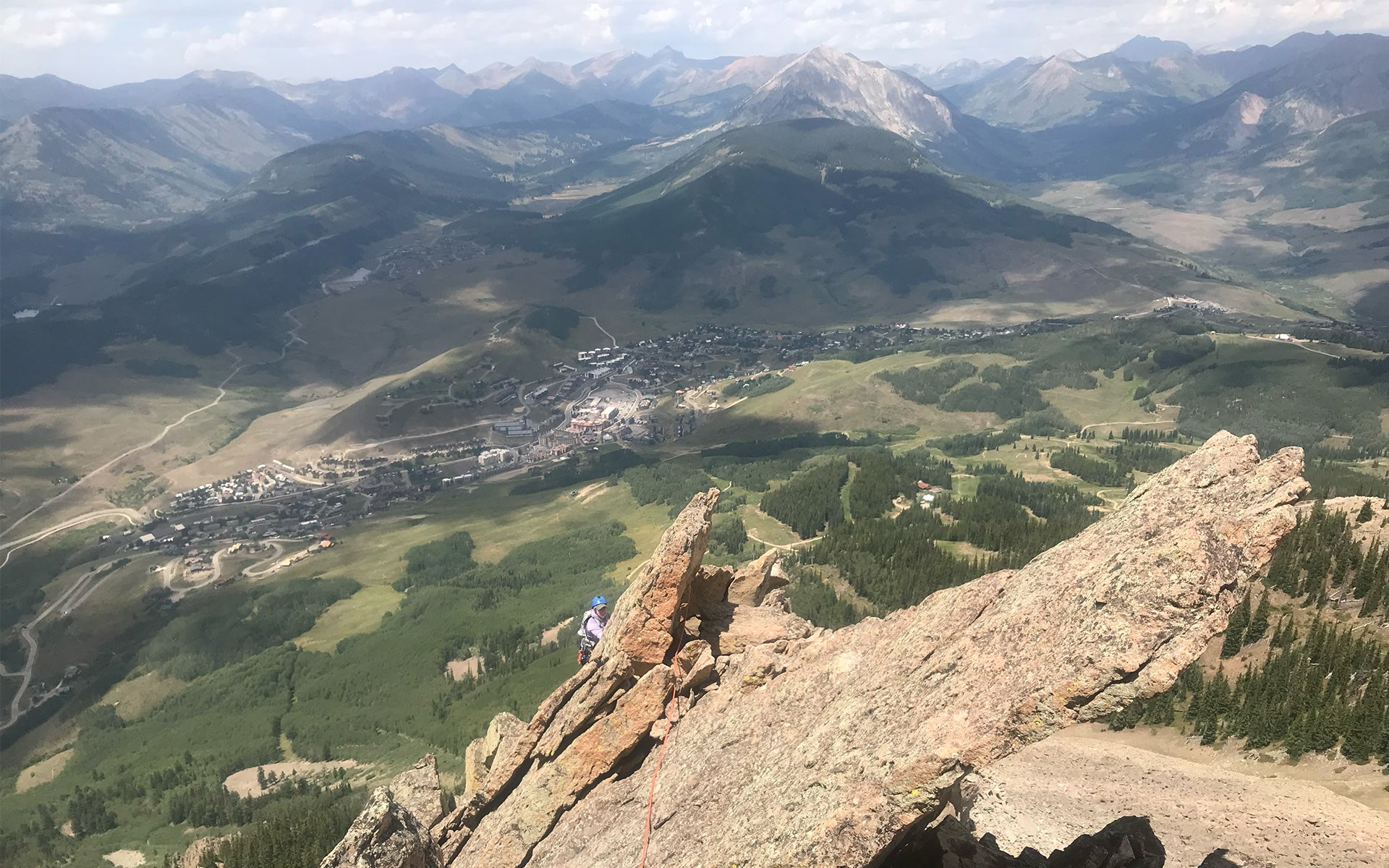 Looking back on program attendee climbing a line. 